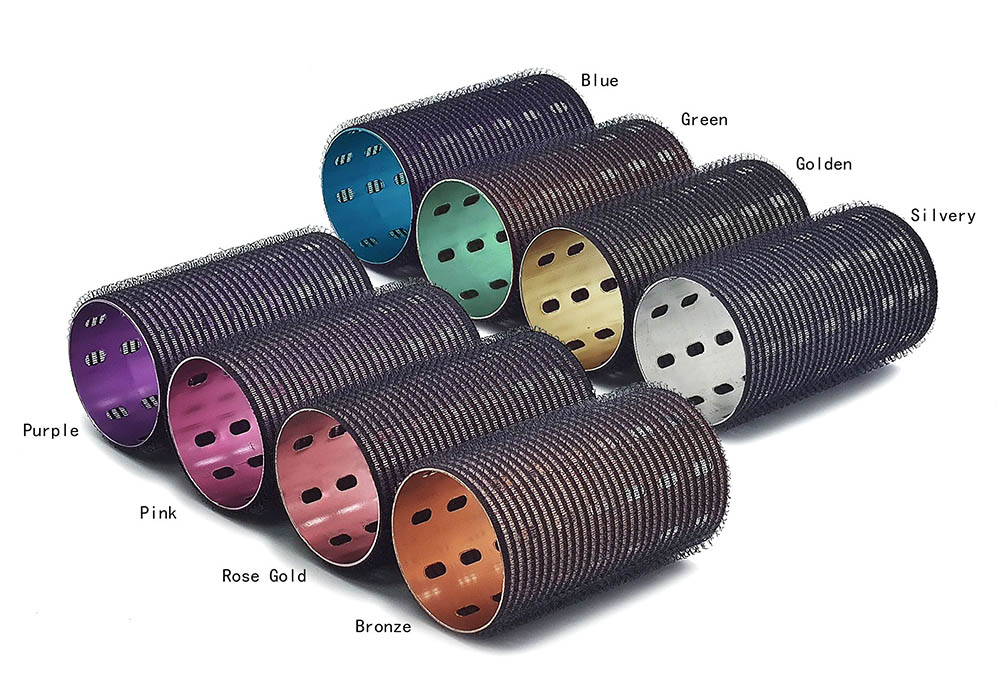 Gold, rose gold, and custom Pantone-colored metal hair rollers displayed in professional salon lighting